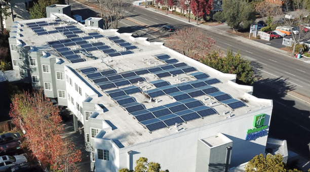 Aerial view of multi-family apartment rooftop solar system