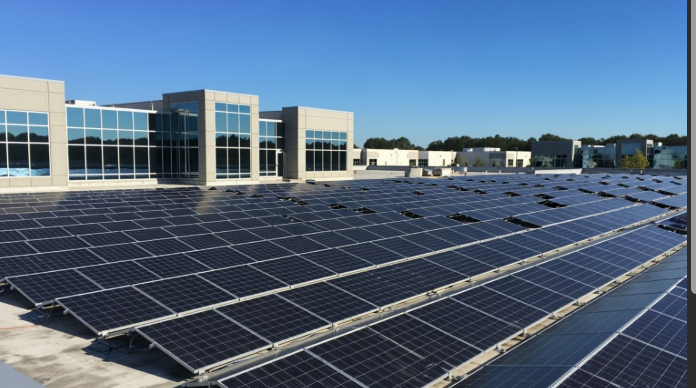 Large commercial rooftop solar array on an office building